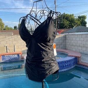 Black swim suit with cris cross adjustable straps on the back